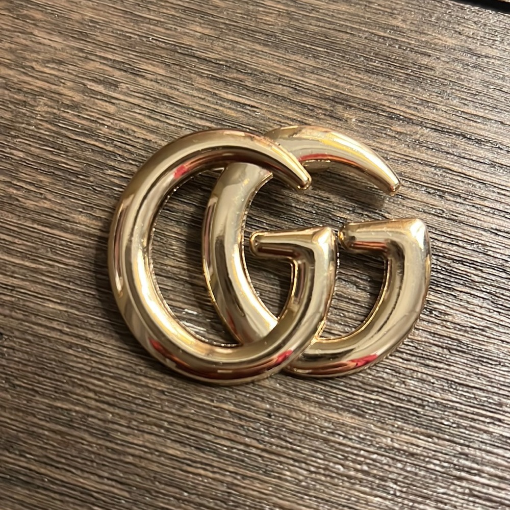 Initial brooch